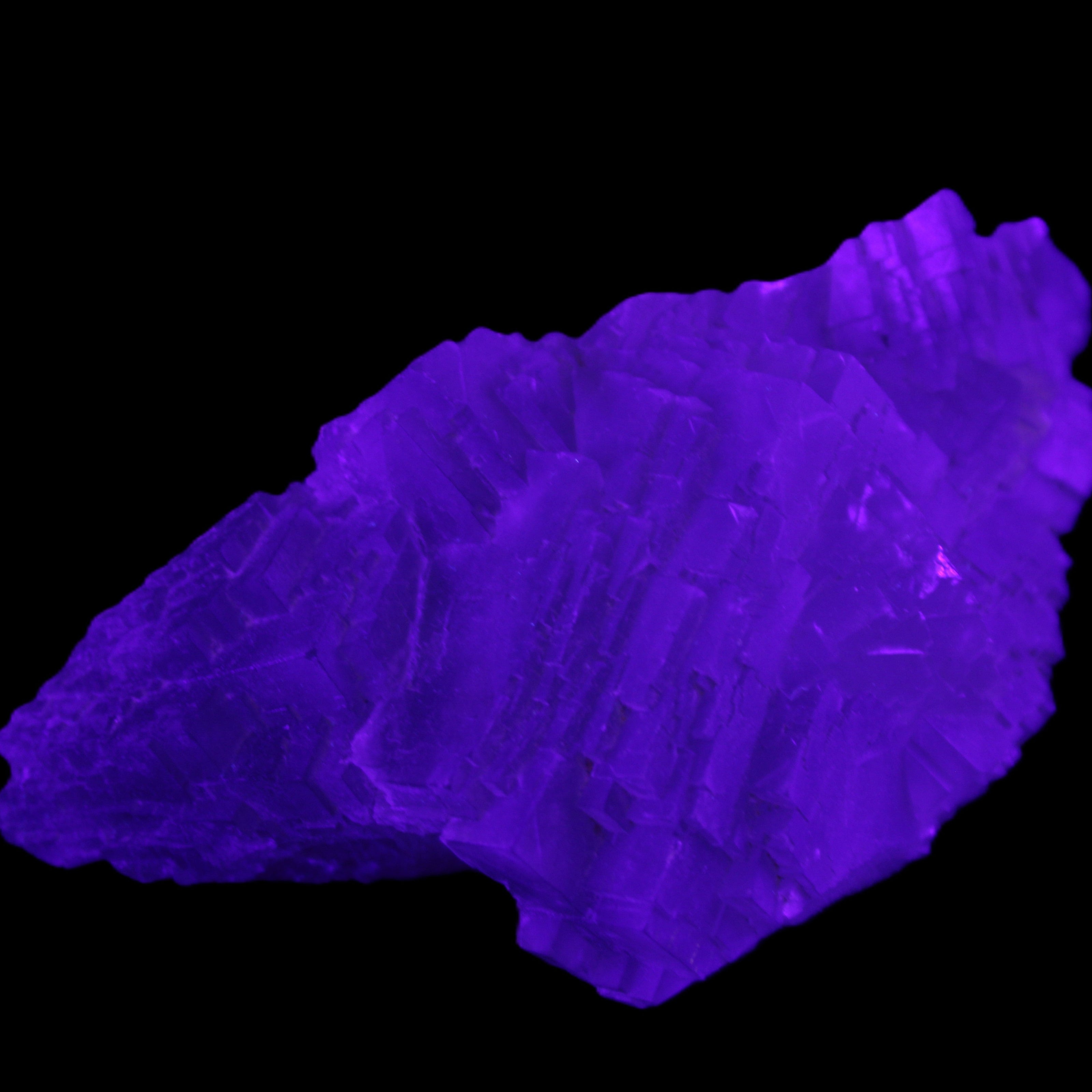 Clear Fluorite cluster 111*51*50mm 306g in UV light - Rocks and Things Store