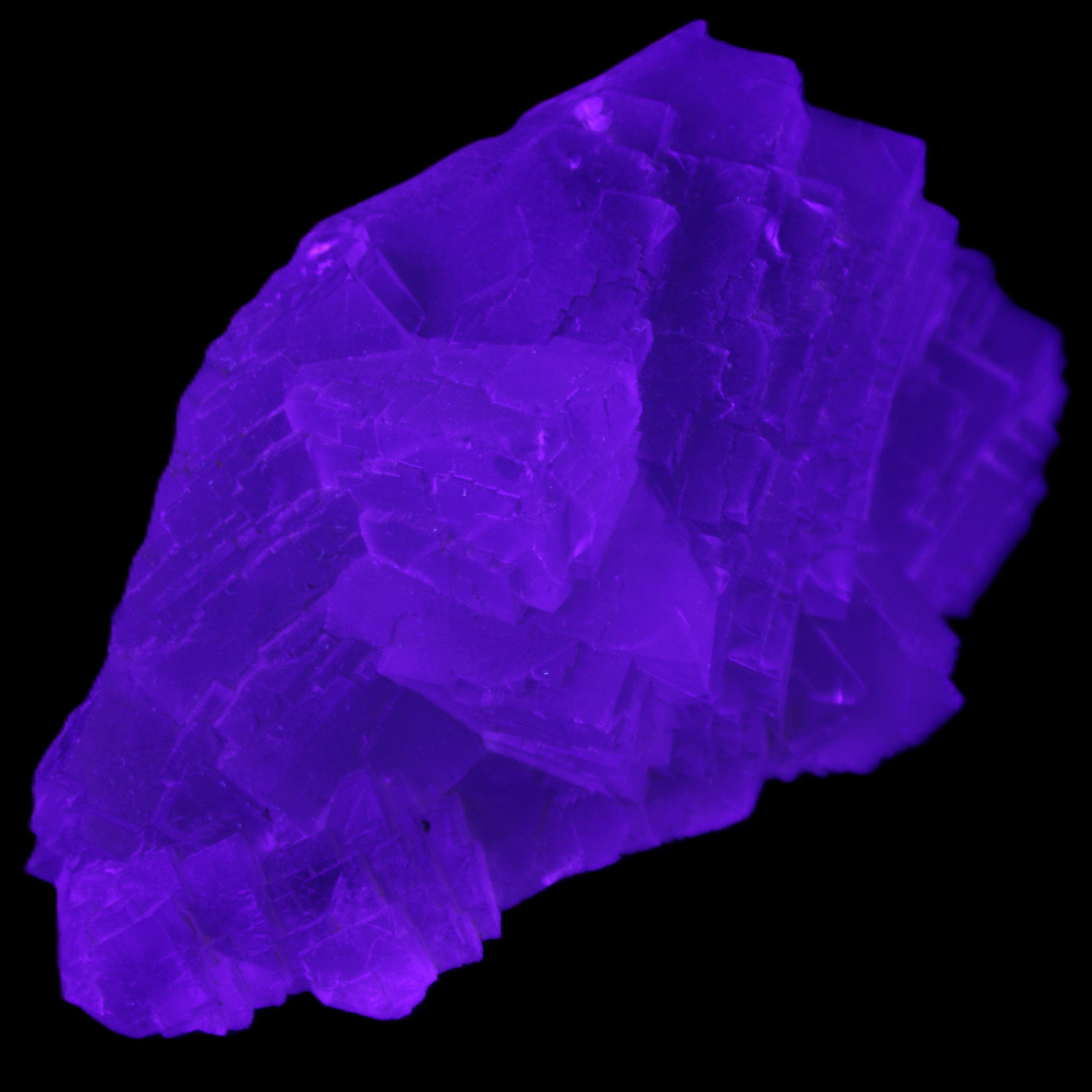 Clear Fluorite cluster 111*51*50mm 306g in UV light - Rocks and Things Store