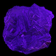 Clear Fluorite cubic stepped cluster 104*72*50mm 660g in UV light - Rocks and Things Store