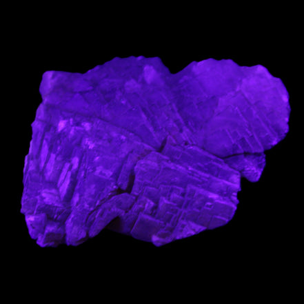 Clear Fluorite stepped cluster 87*80*28mm 238g in UV light - Rocks and Things Store
