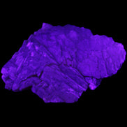 Clear Fluorite stepped cluster 87*80*28mm 238g in UV light - Rocks and Things Store