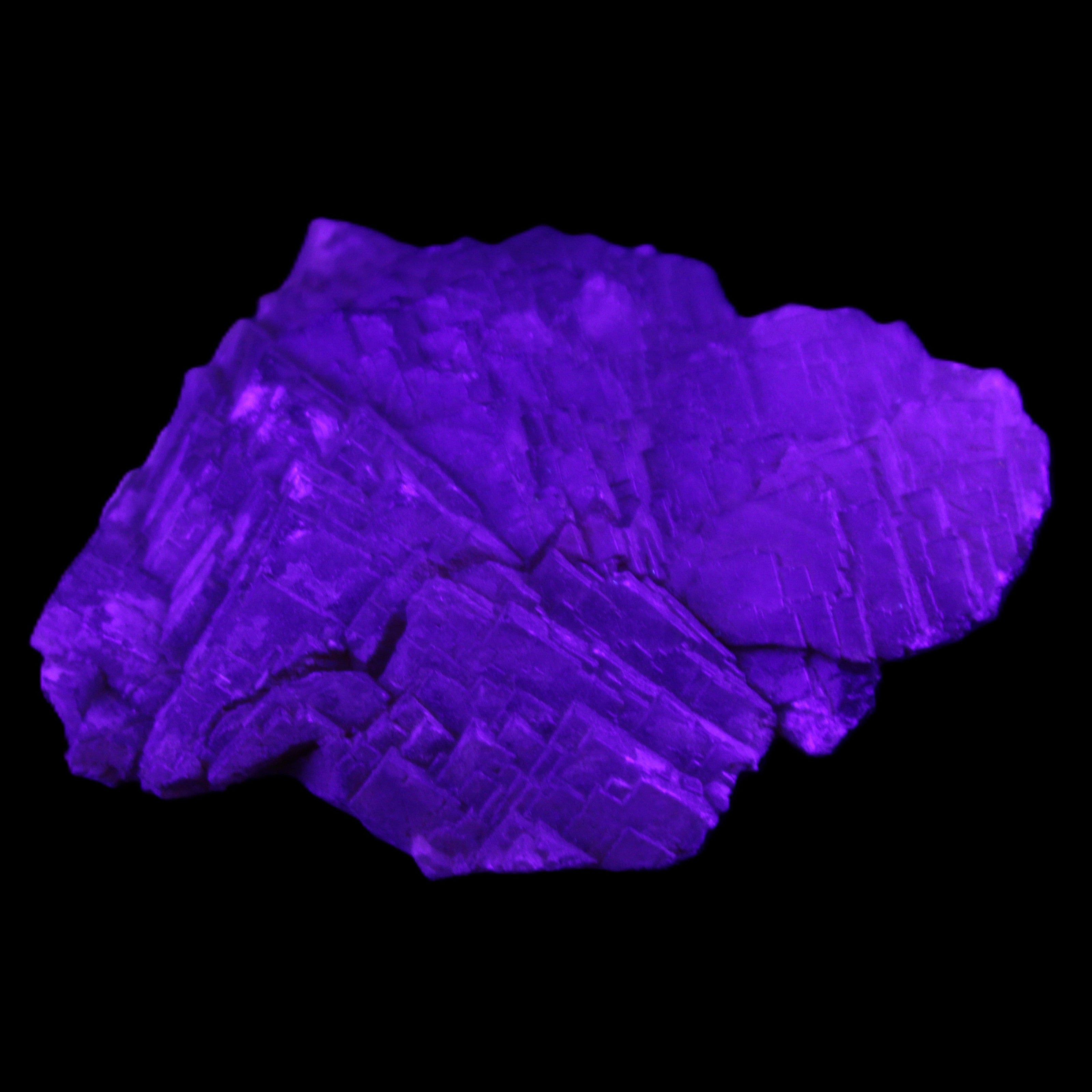 Clear Fluorite stepped cluster 87*80*28mm 238g in UV light - Rocks and Things Store