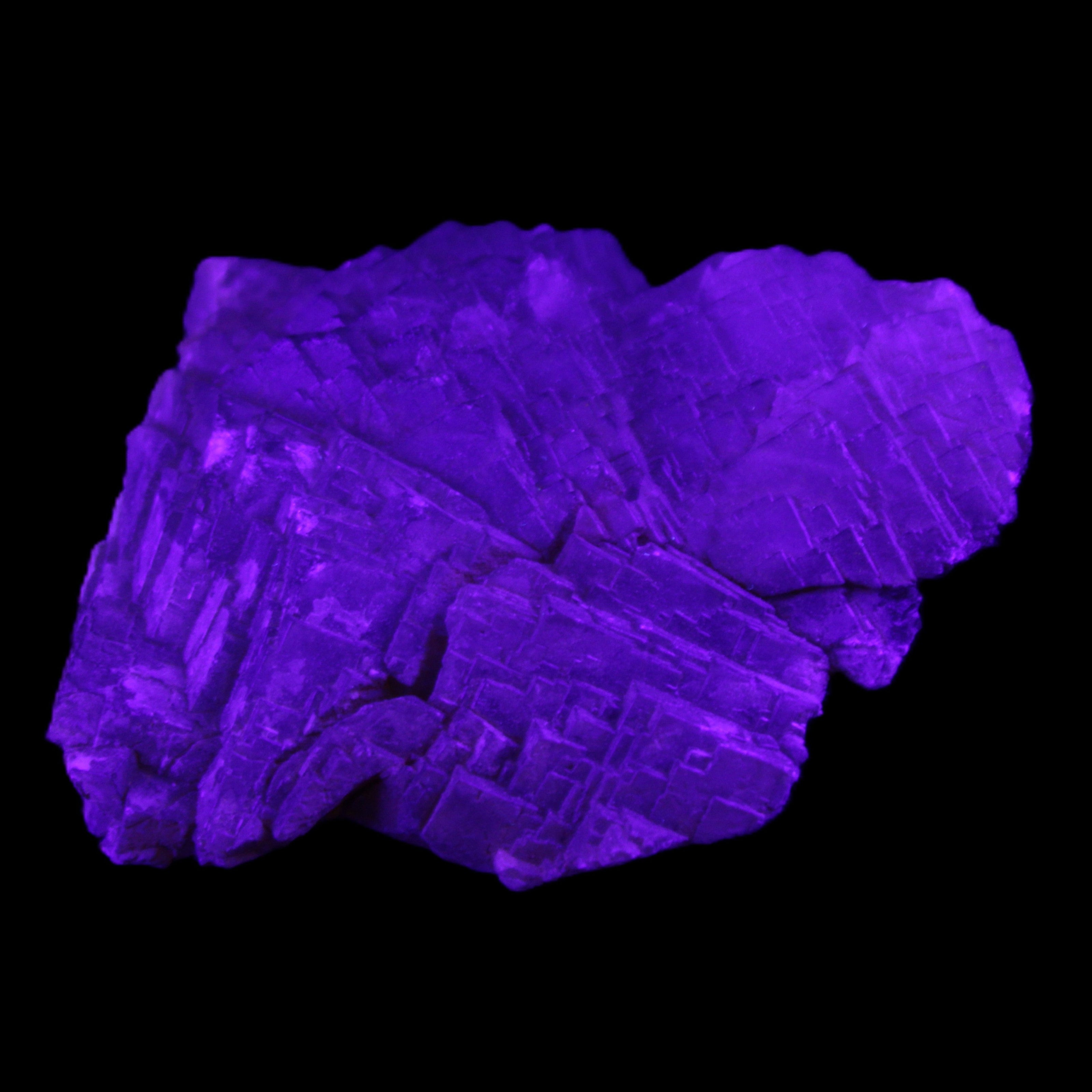 Clear Fluorite stepped cluster 87*80*28mm 238g in UV light - Rocks and Things Store
