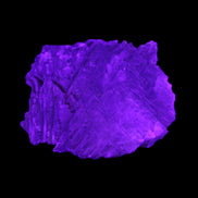 Clear Fluorite stepped cluster 87*80*28mm 238g in UV light - Rocks and Things Store
