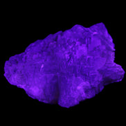 Clear Fluorite stepped cluster 87*80*28mm 238g in UV light - Rocks and Things Store