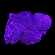 Clear Fluorite stepped cluster 87*80*28mm 238g in UV light - Rocks and Things Store