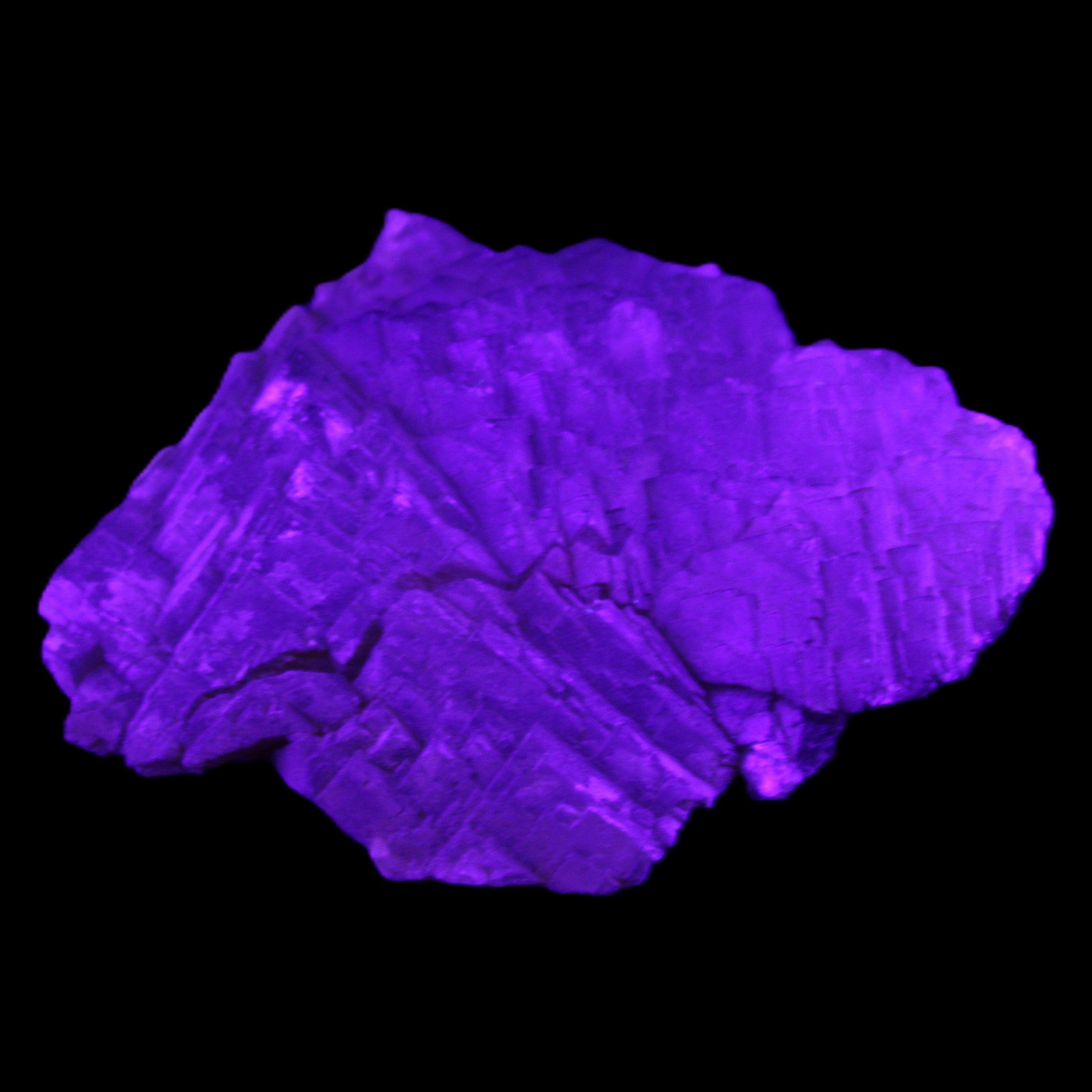 Clear Fluorite stepped cluster 87*80*28mm 238g in UV light - Rocks and Things Store
