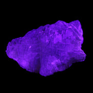 Clear Fluorite stepped cluster 87*80*28mm 238g in UV light - Rocks and Things Store