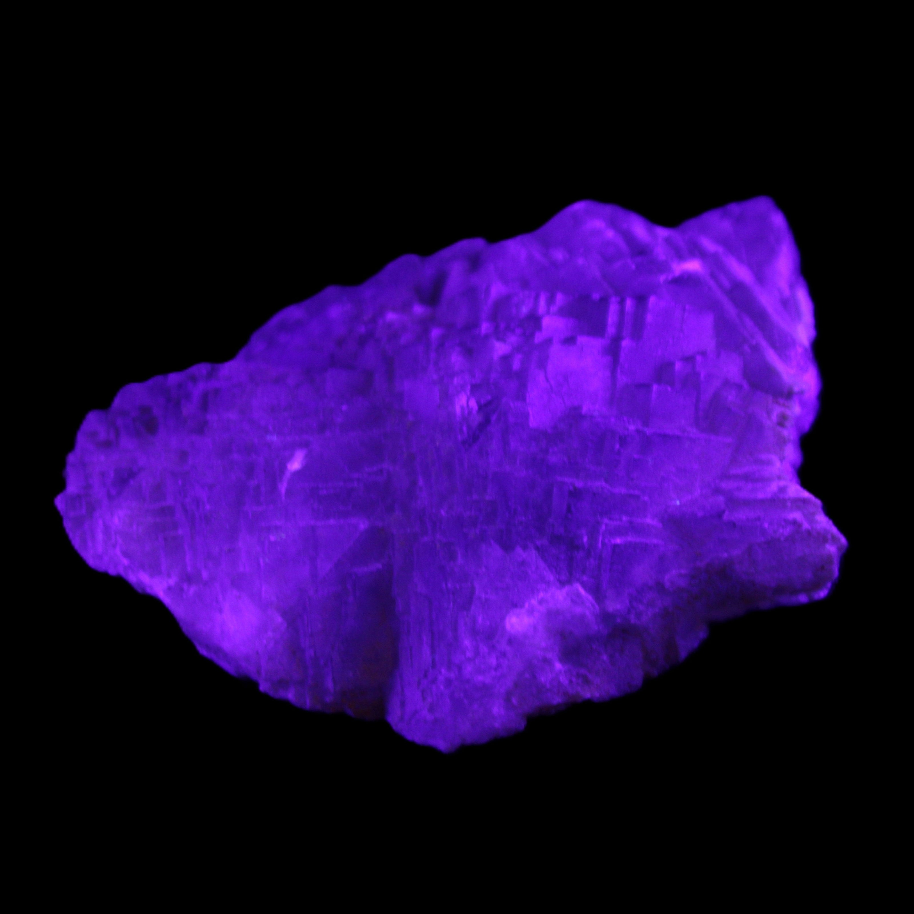 Clear Fluorite stepped cluster 87*80*28mm 238g in UV light - Rocks and Things Store