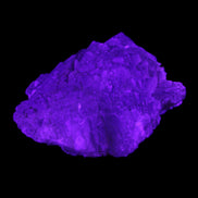 Clear Fluorite stepped cluster 87*80*28mm 238g in UV light - Rocks and Things Store