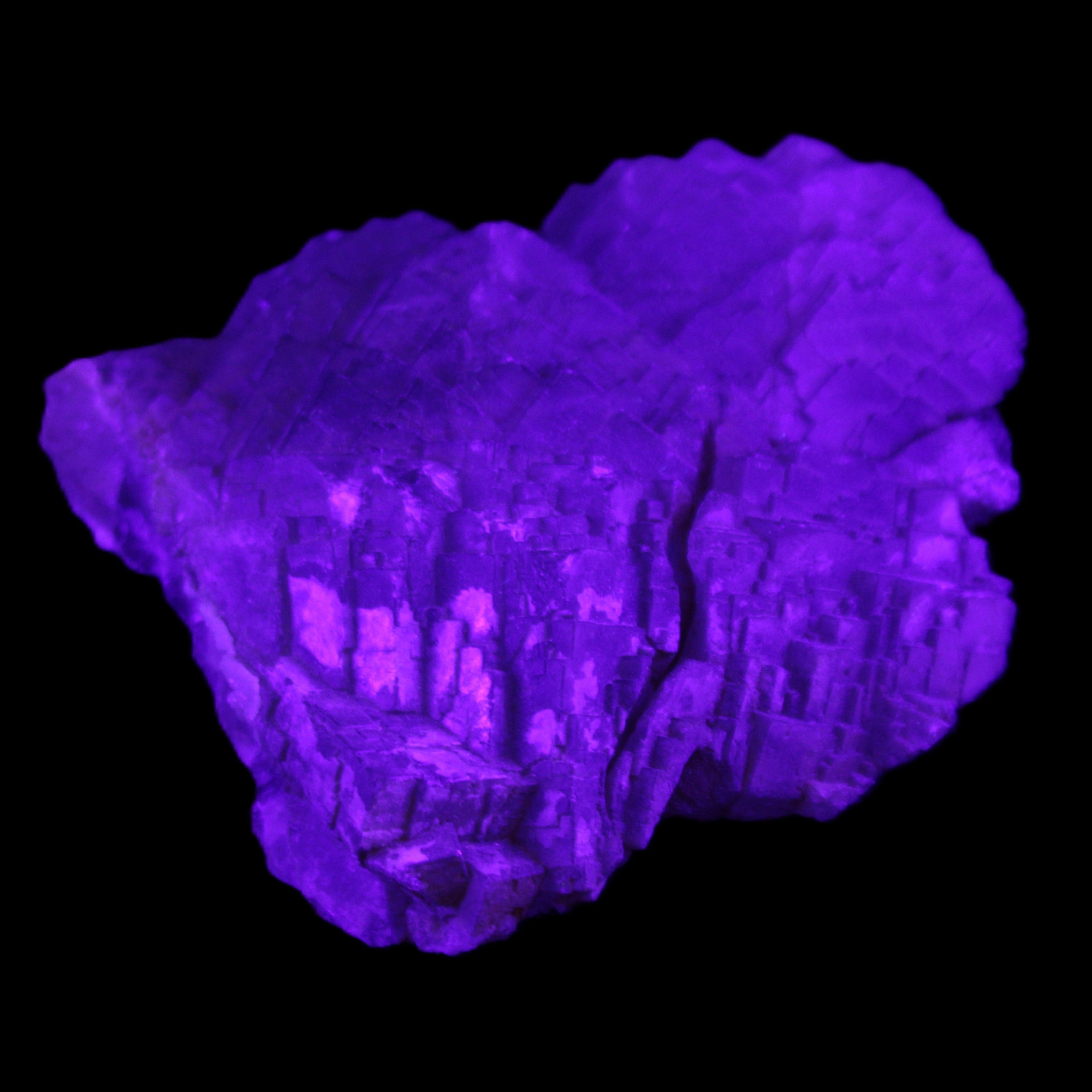 Clear Fluorite stepped cluster 87*80*28mm 238g in UV light - Rocks and Things Store