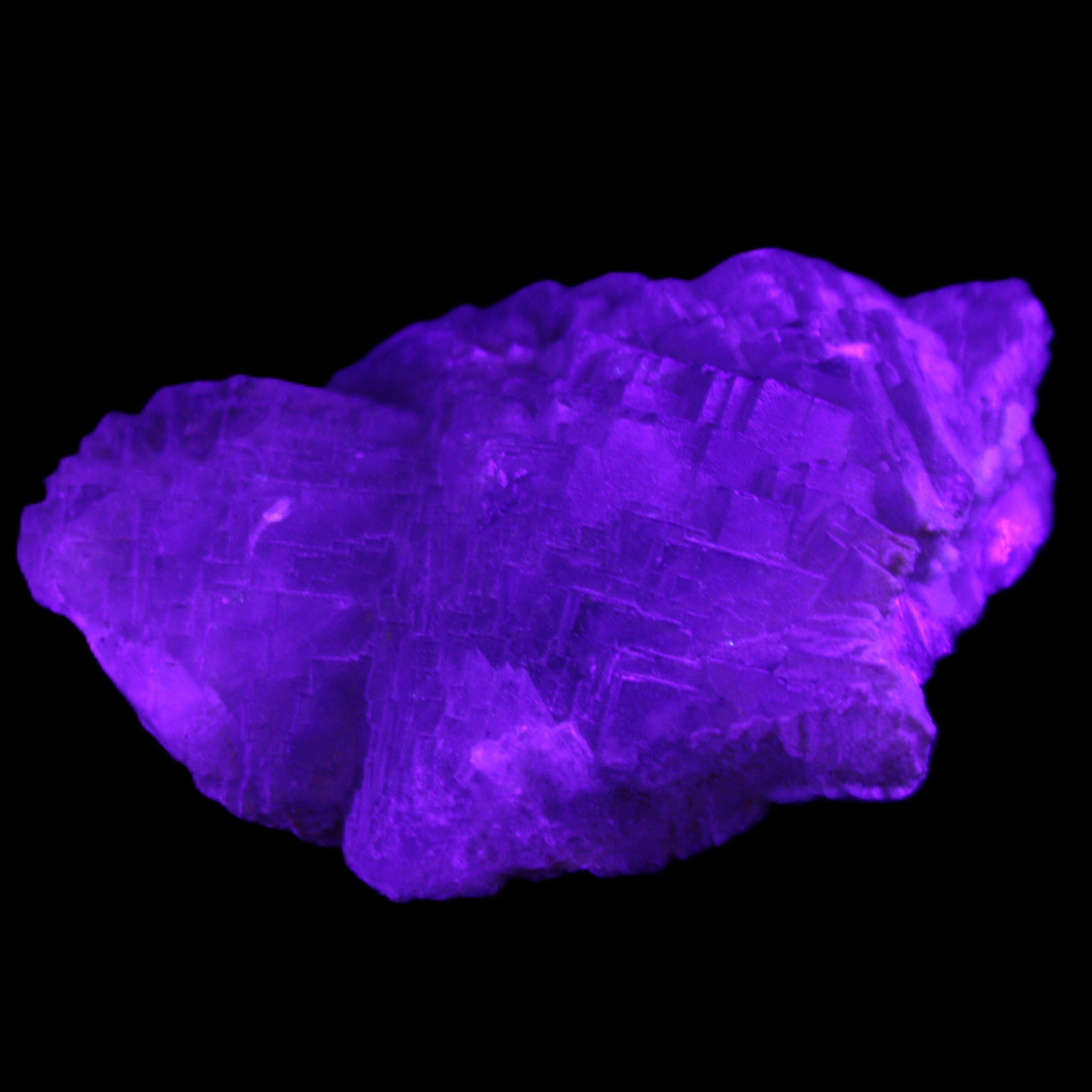 Clear Fluorite stepped cluster 87*80*28mm 238g in UV light - Rocks and Things Store