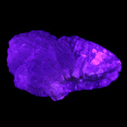 Clear Fluorite stepped cluster 87*80*28mm 238g in UV light - Rocks and Things Store