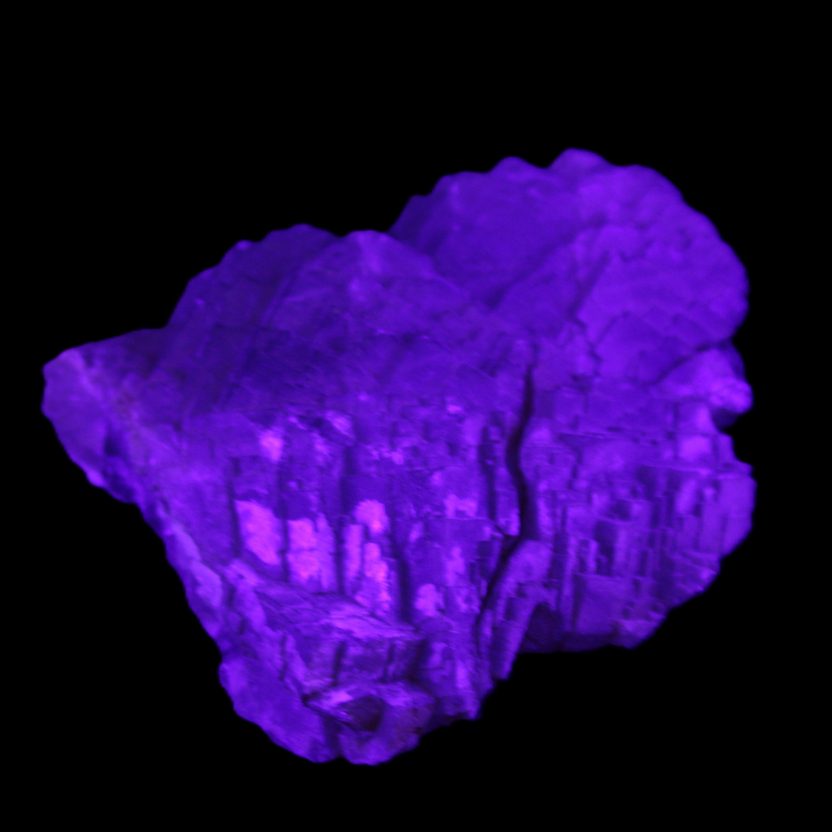 Clear Fluorite stepped cluster 87*80*28mm 238g in UV light - Rocks and Things Store