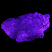 Clear Fluorite stepped cluster 87*80*28mm 238g in UV light - Rocks and Things Store