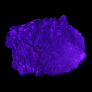 Clear Fluorite stepped cluster 87*80*28mm 238g in UV light - Rocks and Things Store
