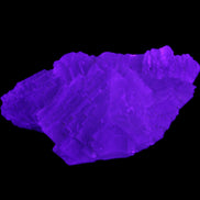 Clear Fluorite stepped cluster 87*80*28mm 238g in UV light - Rocks and Things Store