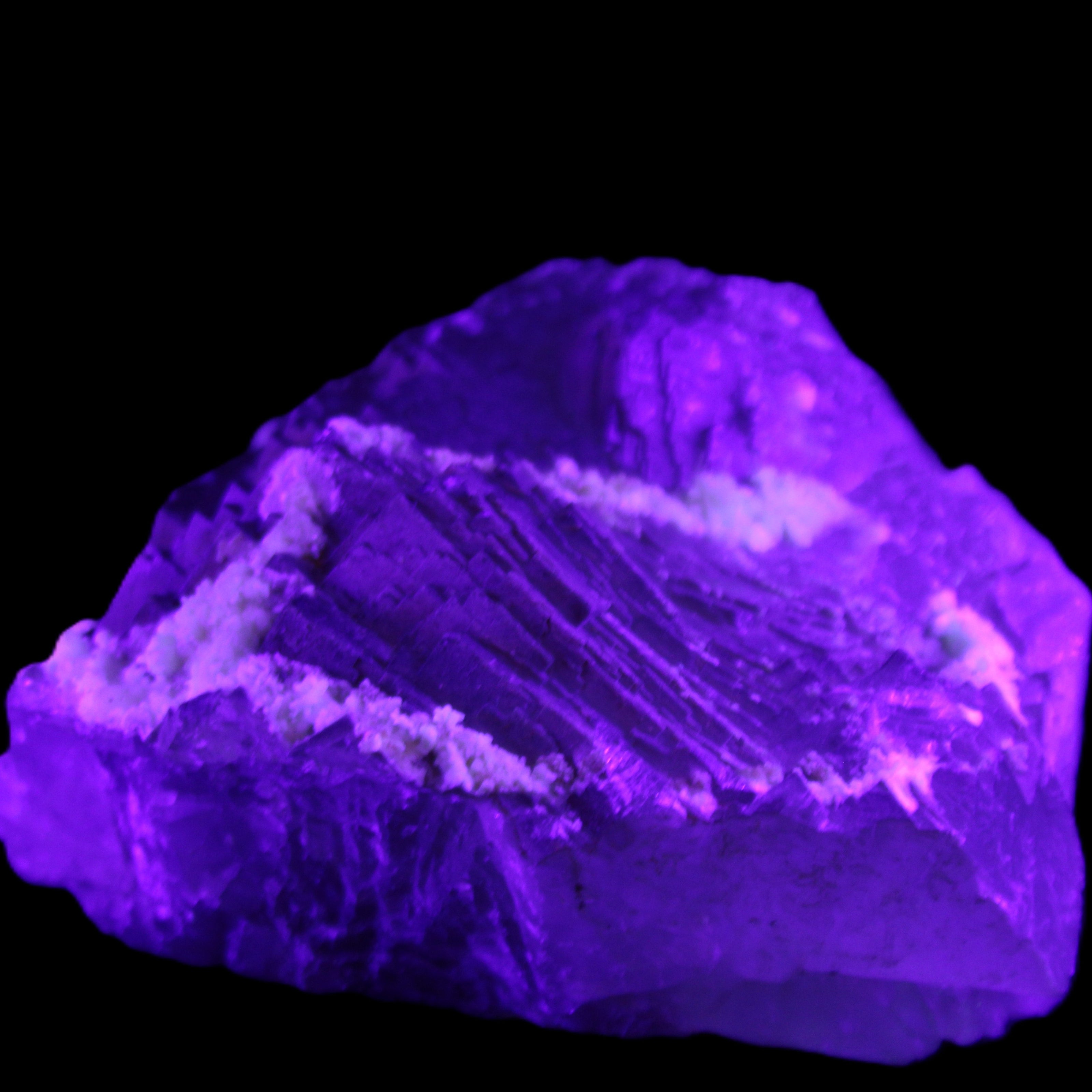 Clear and Coloured Fluorite cluster 110*100*58mm 1056g in UV light - Rocks and Things Store