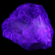 Clear and Coloured Fluorite cluster 110*100*58mm 1056g in UV light - Rocks and Things Store