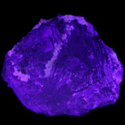 Clear and Coloured Fluorite cluster 110*100*58mm 1056g in UV light - Rocks and Things Store
