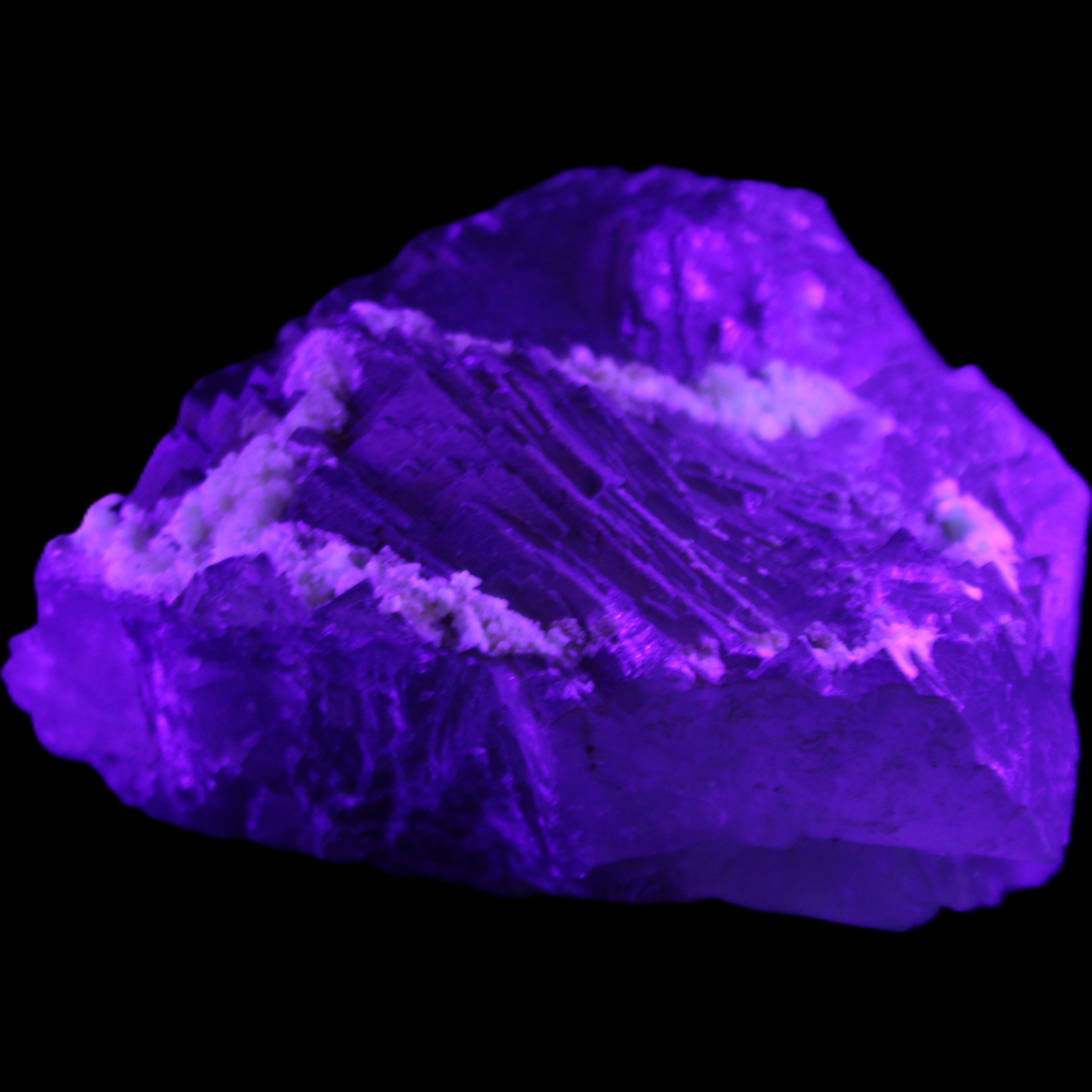 Clear and Coloured Fluorite cluster 110*100*58mm 1056g in UV light - Rocks and Things Store
