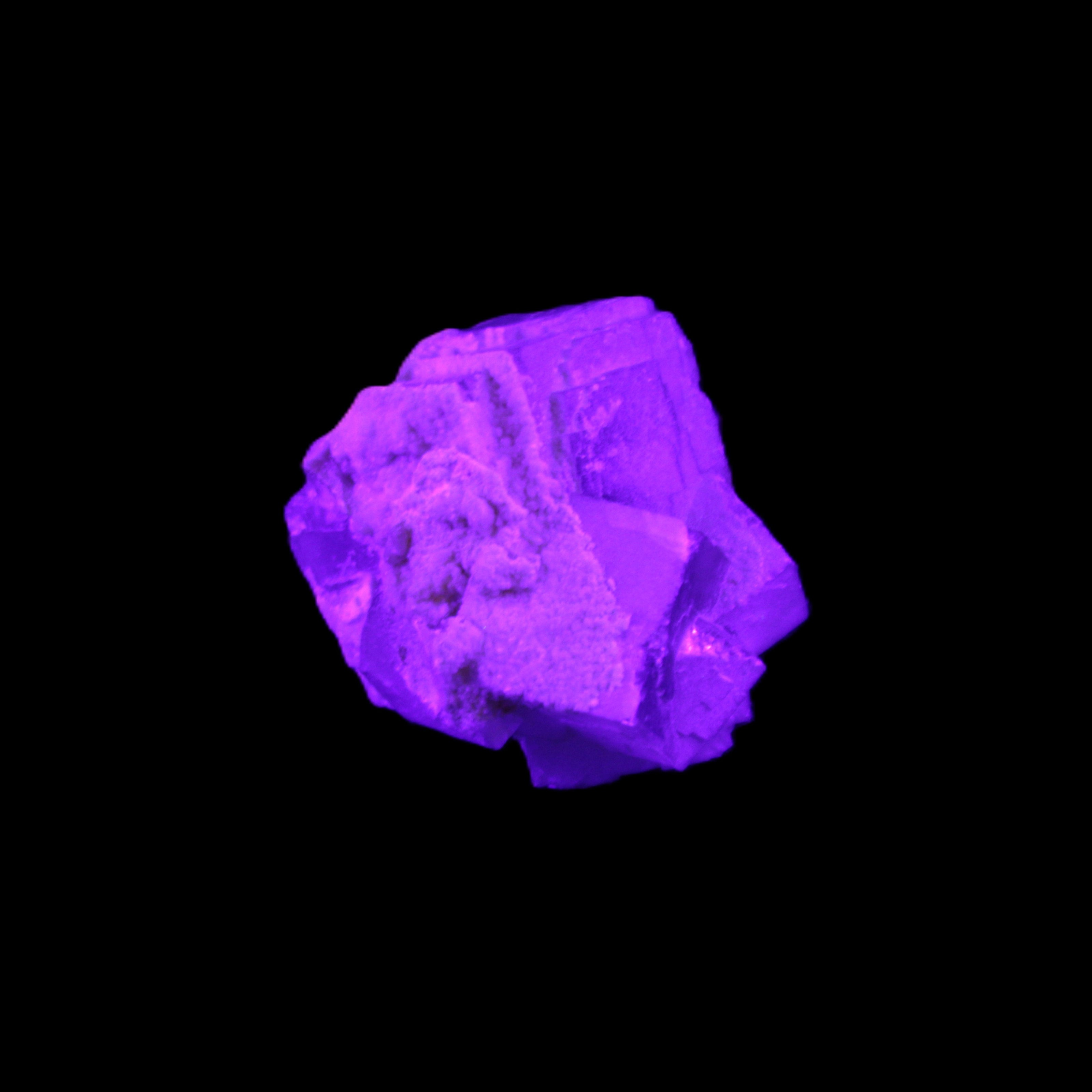 Clear Fluorite cubic cluster 45*40*40mm 102g in UV light - Rocks and Things Store