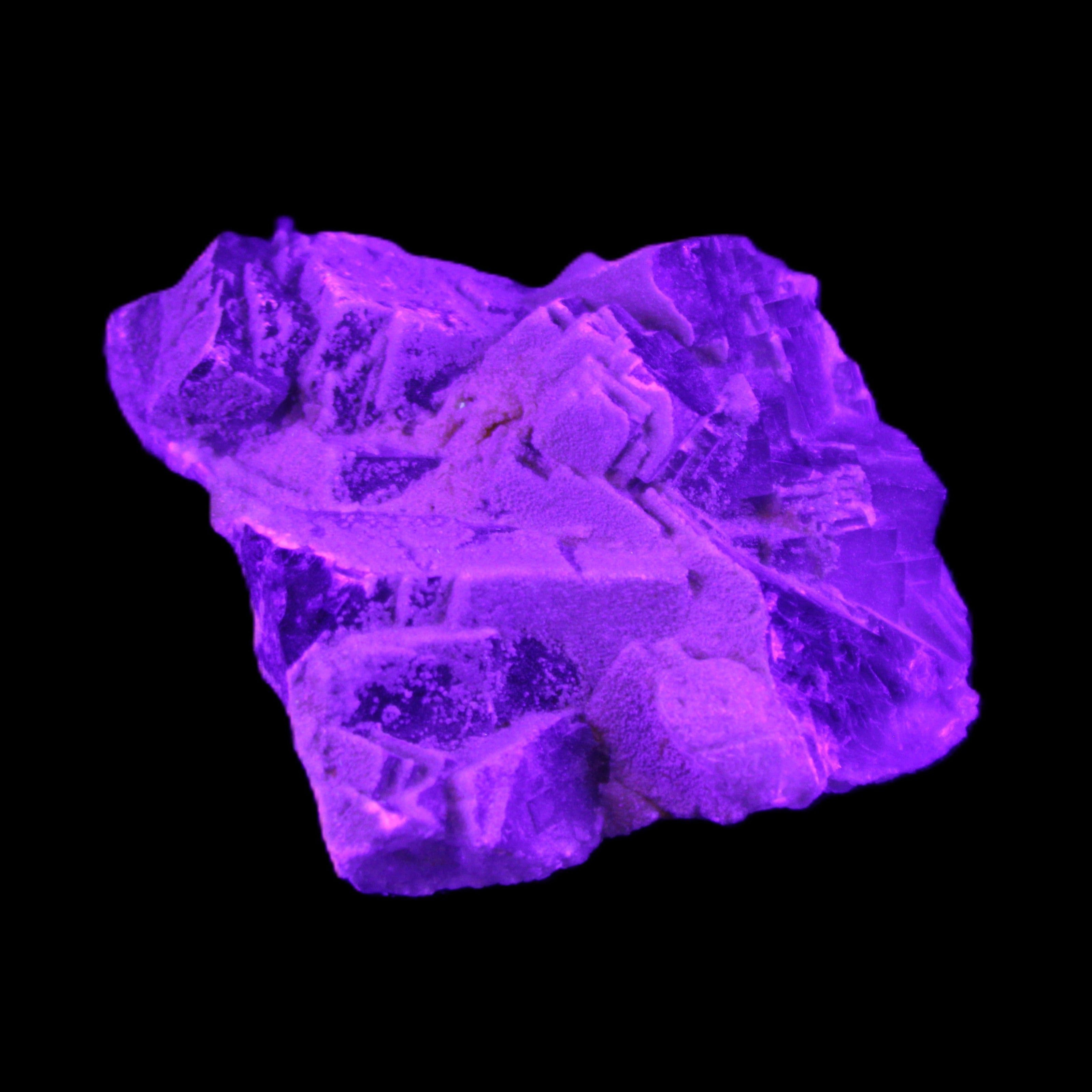 Clear Fluorite cubic cluster 62*60*28mm 104g in UV light - Rocks and Things Store