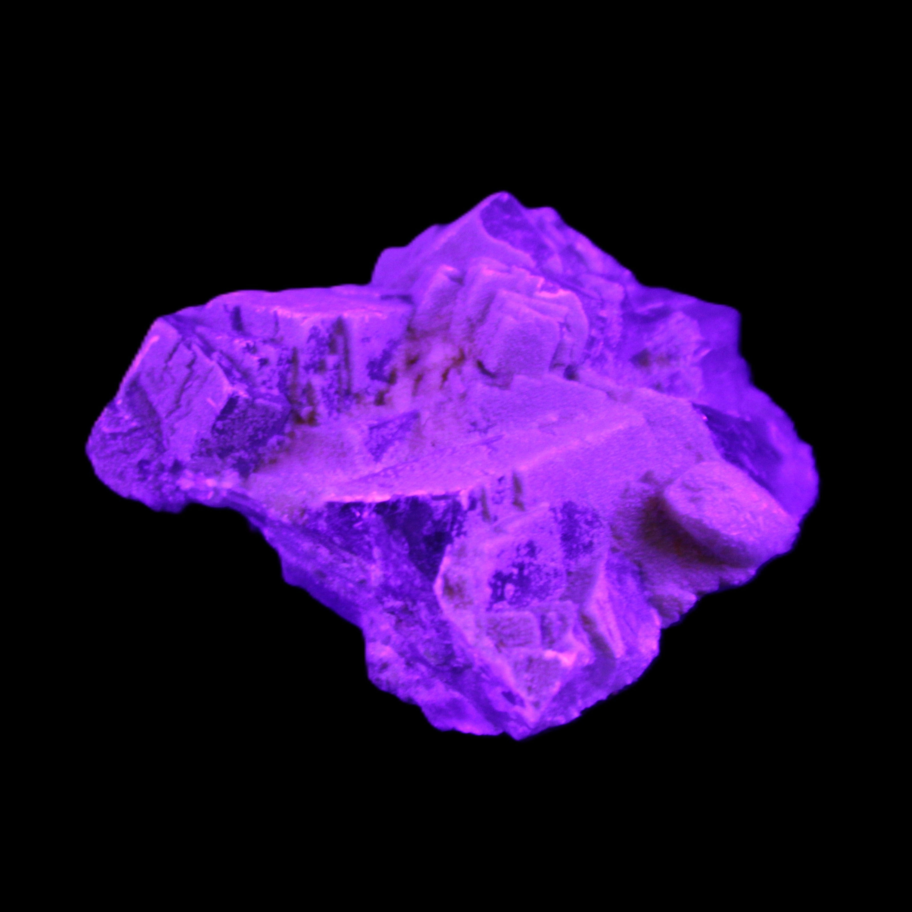 Clear Fluorite cubic cluster 62*60*28mm 104g in UV light - Rocks and Things Store