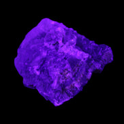 Clear Fluorite cubic cluster 62*60*28mm 104g in UV light - Rocks and Things Store