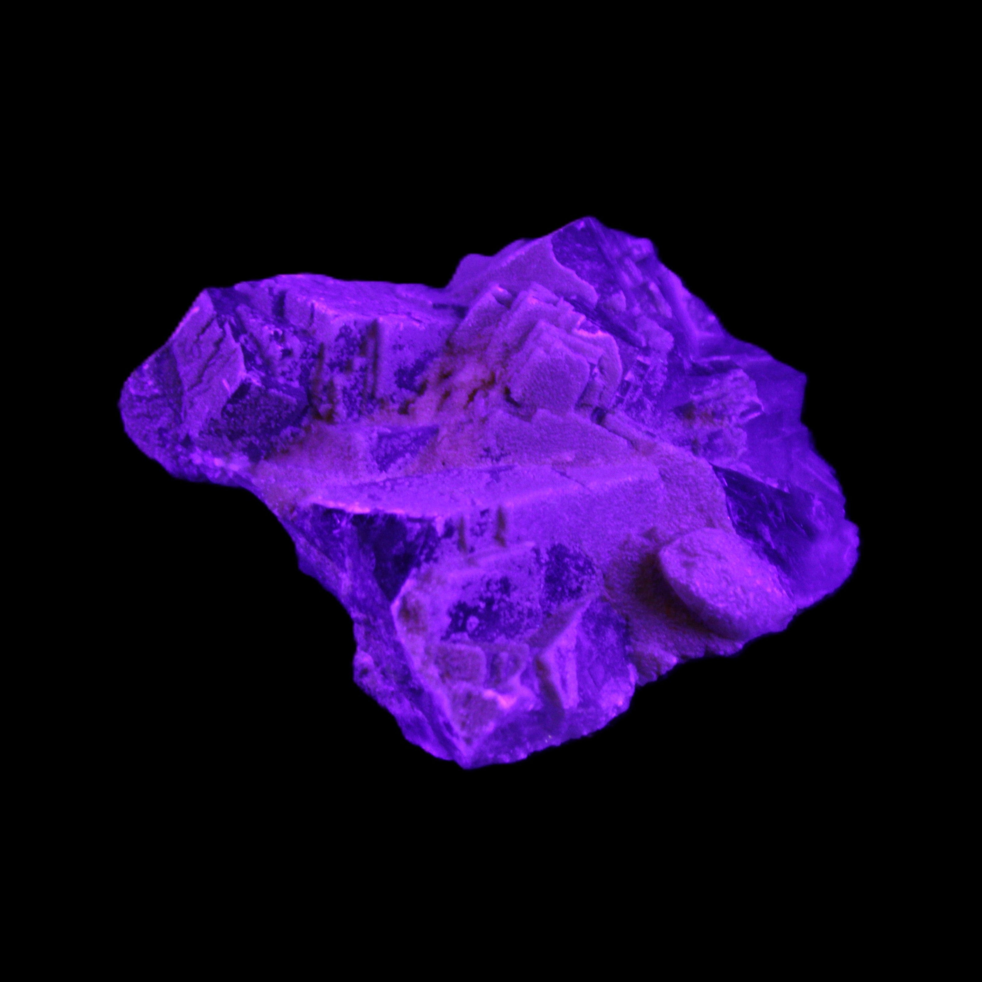 Clear Fluorite cubic cluster 62*60*28mm 104g in UV light - Rocks and Things Store