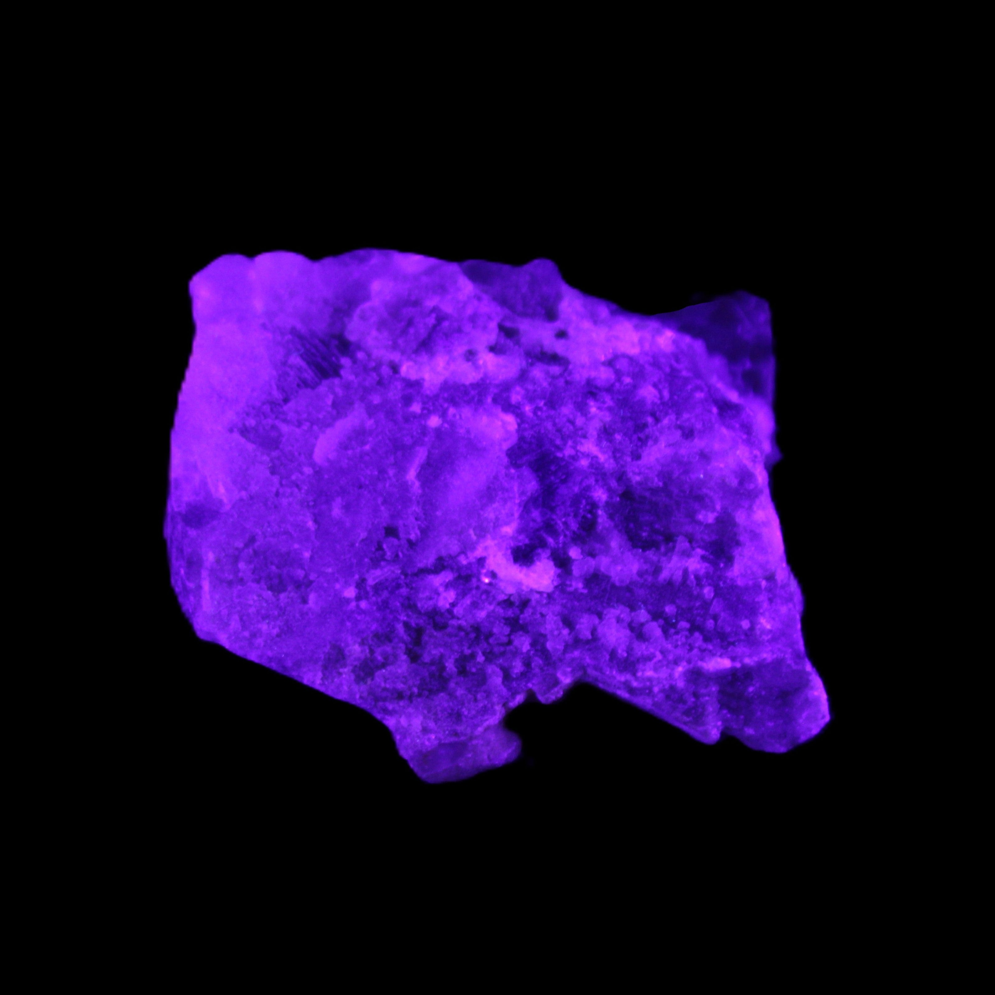 Clear Fluorite cubic cluster 62*60*28mm 104g in UV light - Rocks and Things Store