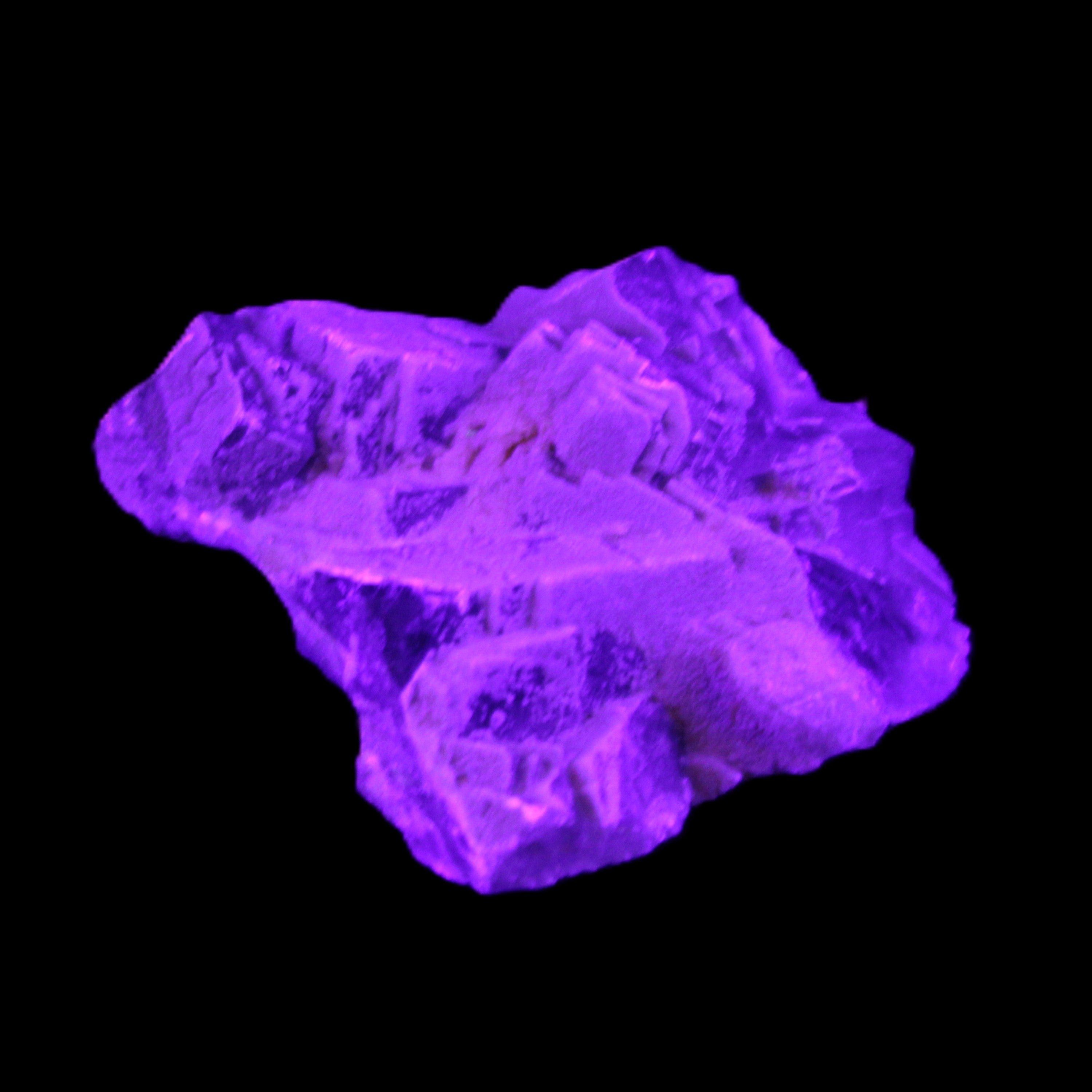 Clear Fluorite cubic cluster 62*60*28mm 104g in UV light - Rocks and Things Store