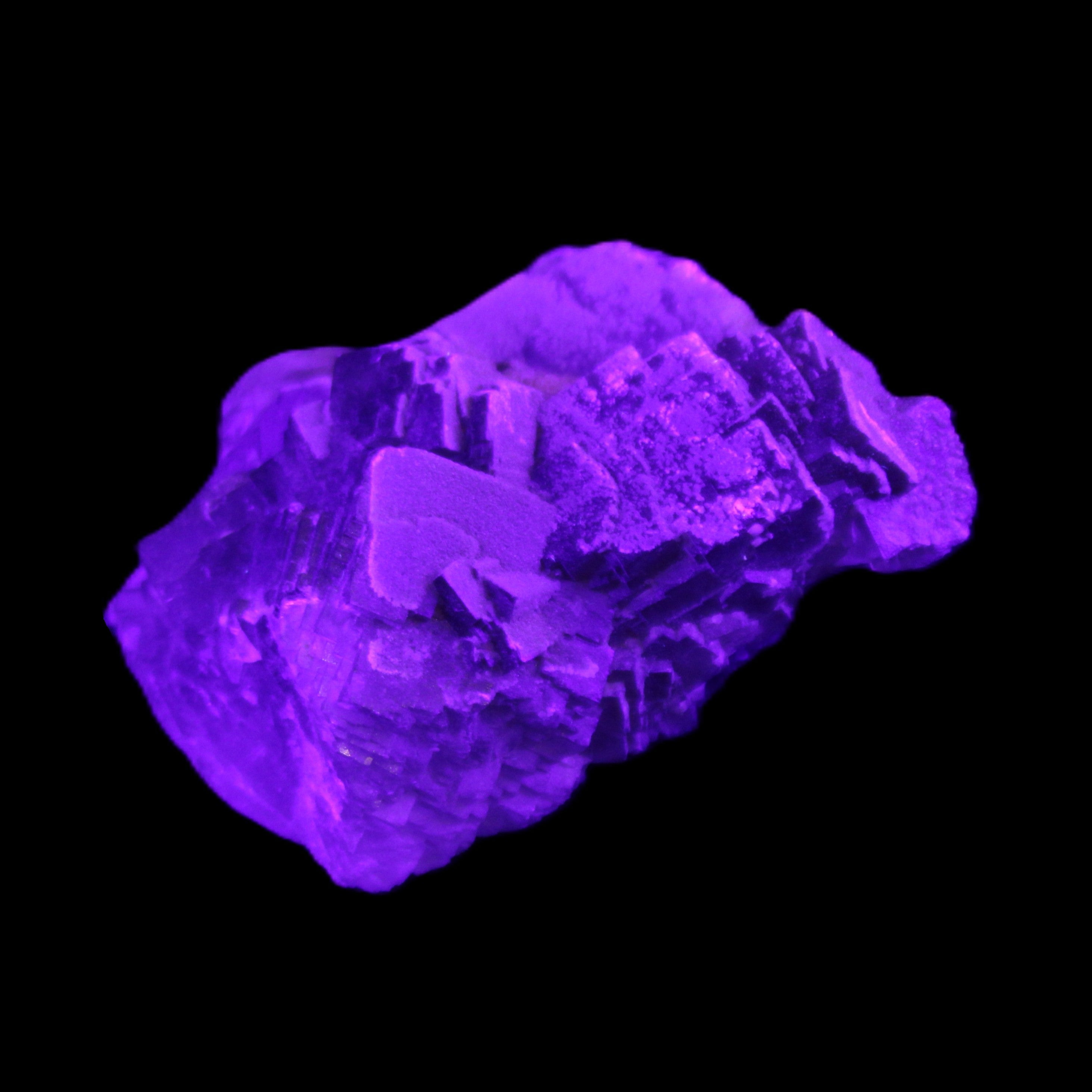 Clear Fluorite cubic cluster 62*60*28mm 104g in UV light - Rocks and Things Store