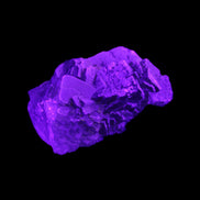 Clear Fluorite cubic cluster 62*60*28mm 104g in UV light - Rocks and Things Store