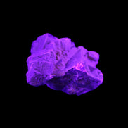 Clear Fluorite cubic cluster 62*60*28mm 104g in UV light - Rocks and Things Store