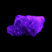 Clear Fluorite cubic cluster 62*60*28mm 104g in UV light - Rocks and Things Store