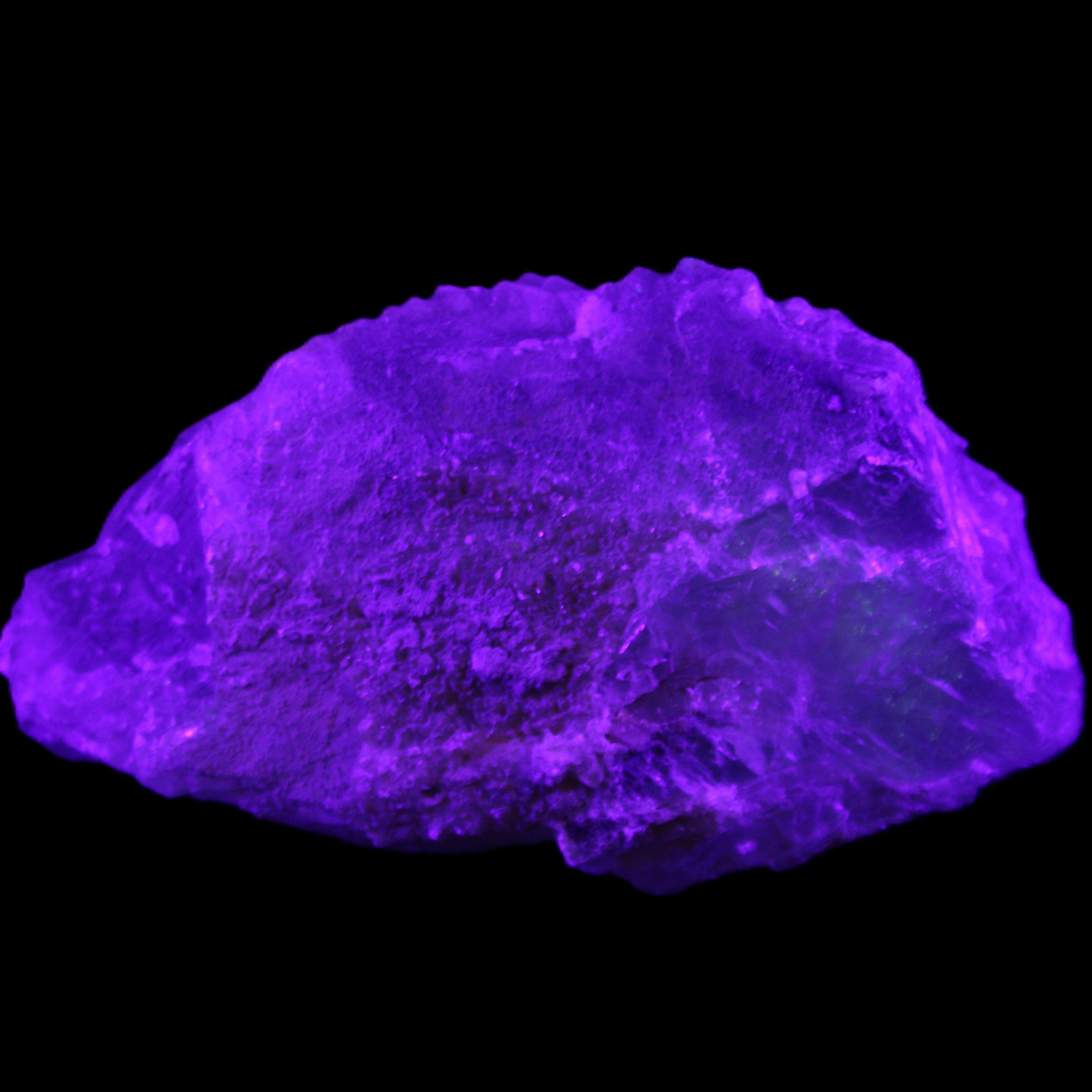 Clear Blue Fluorite cluster 105*55*50mm 487g in UV light - Rocks and Things Store