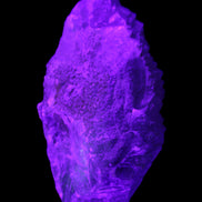 Clear Blue Fluorite cluster 105*55*50mm 487g in UV light - Rocks and Things Store