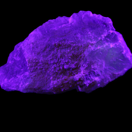 Clear Blue Fluorite cluster 105*55*50mm 487g in UV light - Rocks and Things Store