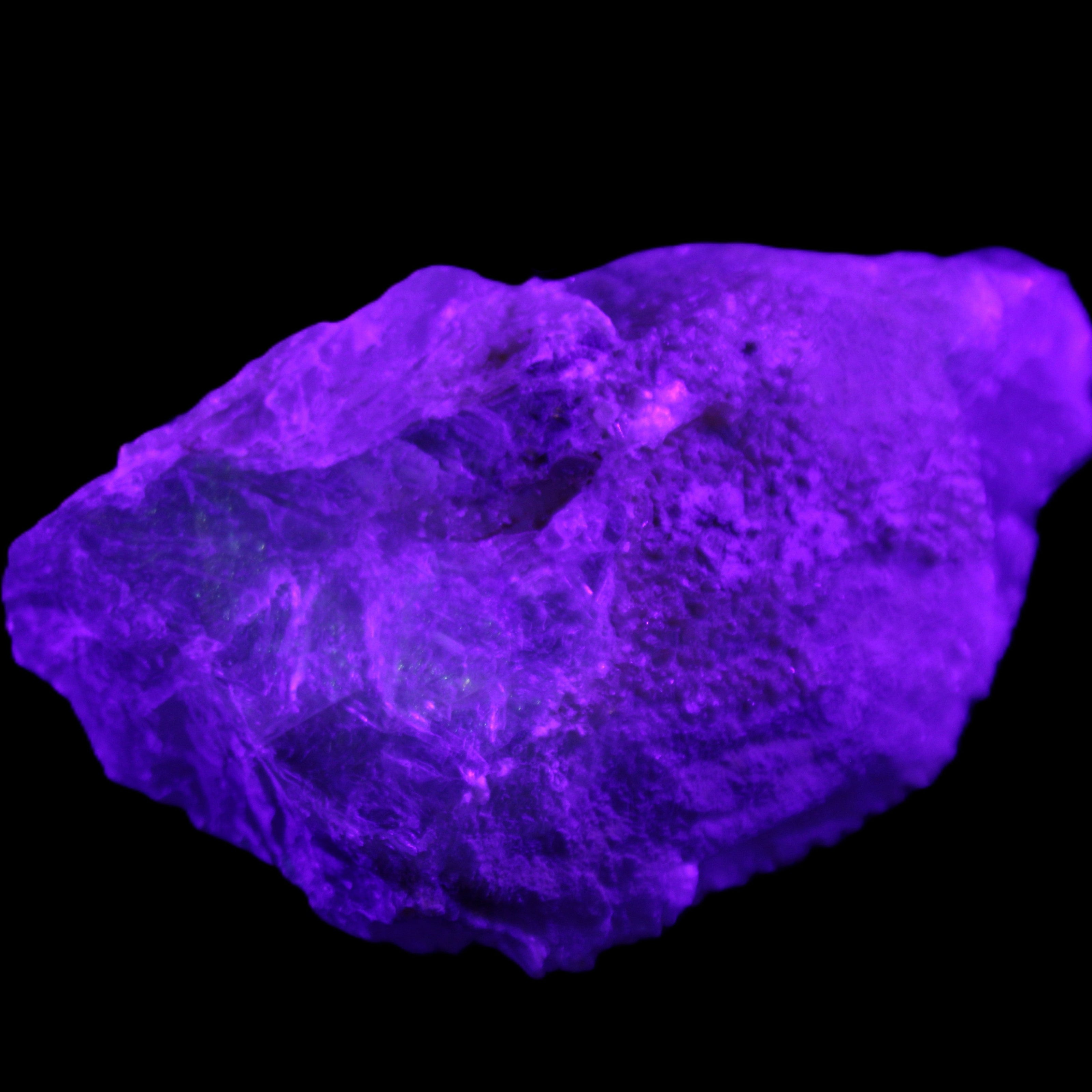 Clear Blue Fluorite cluster 105*55*50mm 487g in UV light - Rocks and Things Store