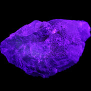 Clear Blue Fluorite cluster 105*55*50mm 487g in UV light - Rocks and Things Store