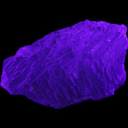 Clear Blue Fluorite cluster 105*55*50mm 487g in UV light - Rocks and Things Store