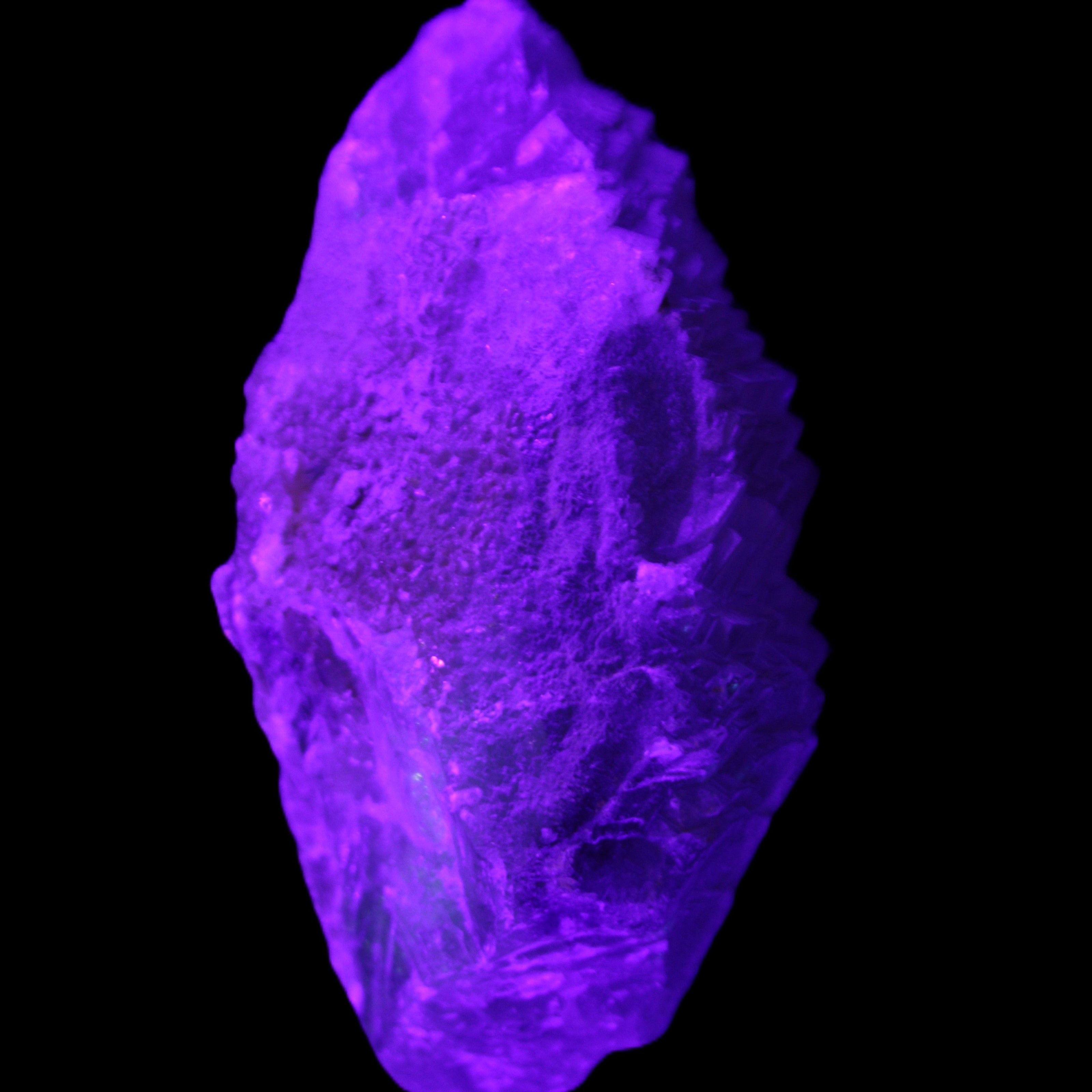 Clear Blue Fluorite cluster 105*55*50mm 487g in UV light - Rocks and Things Store