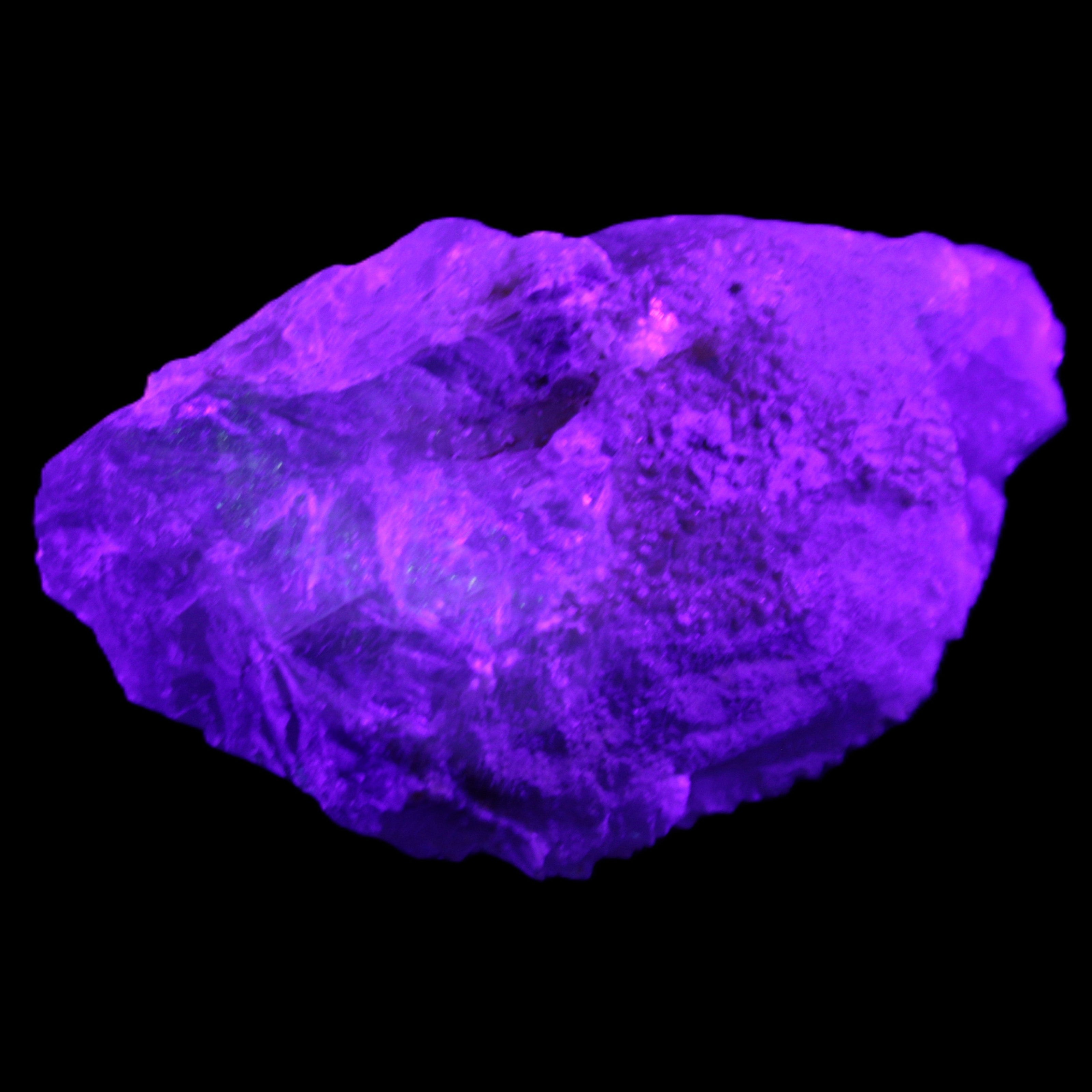 Clear Blue Fluorite cluster 105*55*50mm 487g in UV light - Rocks and Things Store
