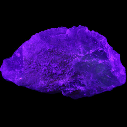 Clear Blue Fluorite cluster 105*55*50mm 487g in UV light - Rocks and Things Store