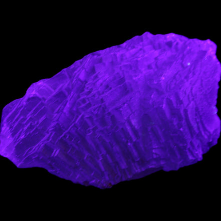 Clear Blue Fluorite cluster 105*55*50mm 487g in UV light - Rocks and Things Store