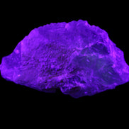 Clear Blue Fluorite cluster 105*55*50mm 487g in UV light - Rocks and Things Store