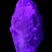 Clear Blue Fluorite cluster 105*55*50mm 487g in UV light - Rocks and Things Store