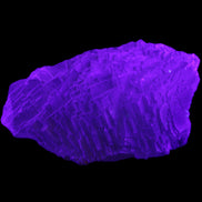 Clear Blue Fluorite cluster 105*55*50mm 487g in UV light - Rocks and Things Store