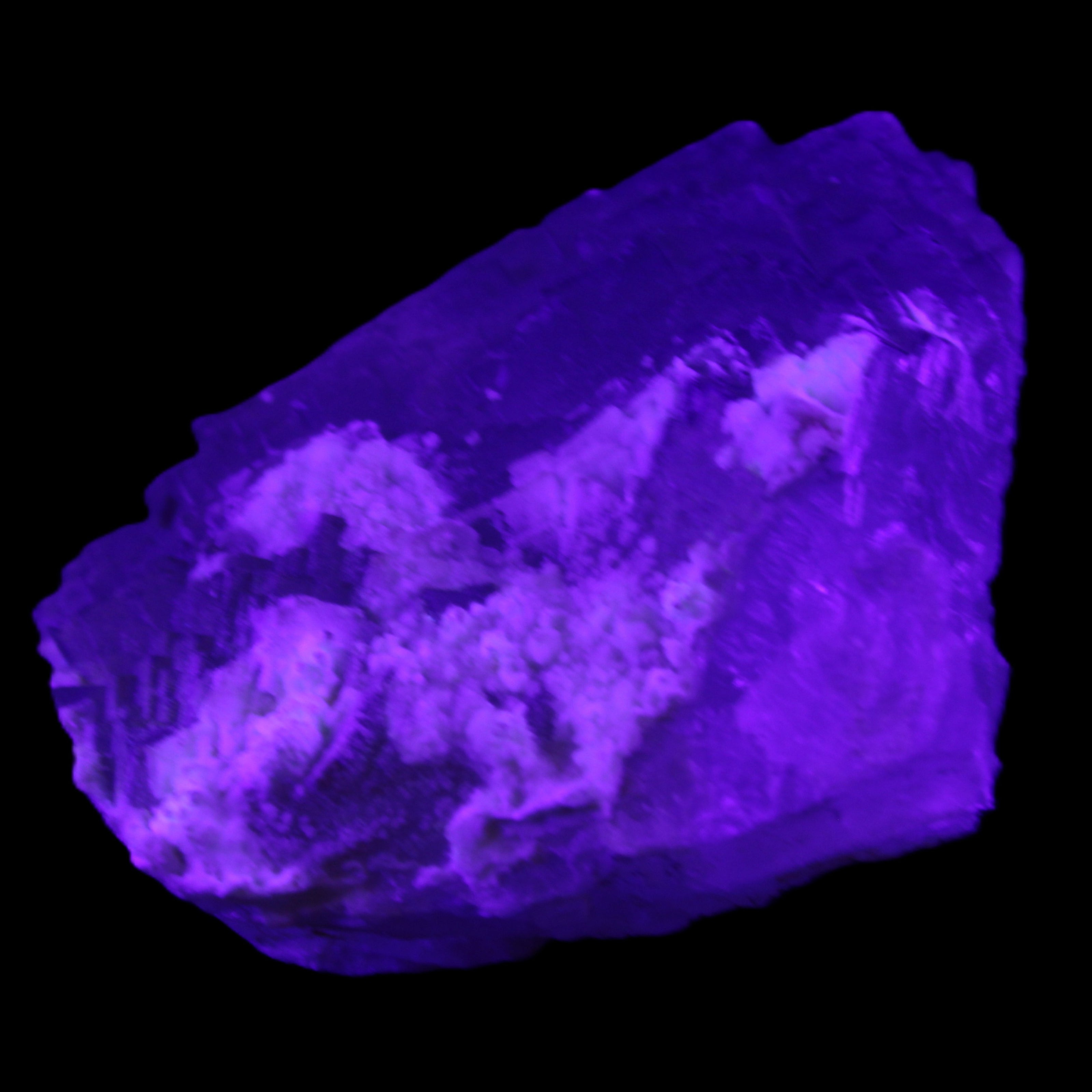 Clear Fluorite stepped cluster 90*80*52mm 523g in UV light - Rocks and Things Store